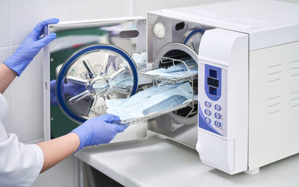 Dental instruments being sterilized in a steam autoclave at ProCare Family Dental in Morton Grove