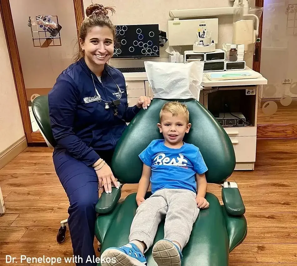 Dr. Penelope Danos with young pediatric dental patient Alekos at ProCare Family Dental in Morton Grove, IL