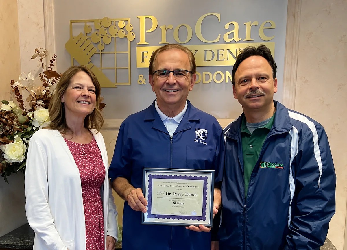 Dr. Perry Danos receiving recognition for 30 years of membership with the Morton Grove Chamber of Commerce at ProCare Family Dental in Morton Grove, Illinois.